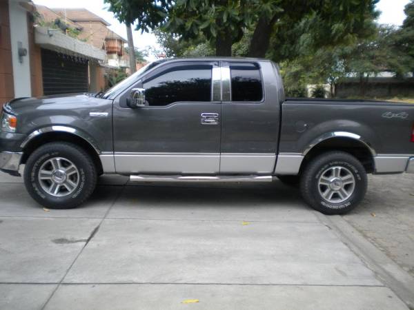 QAA - WZ44309 Molded Stainless Steel Wheel Well Fender Trim 4Pc 2004-2008 Ford F-150 QAA